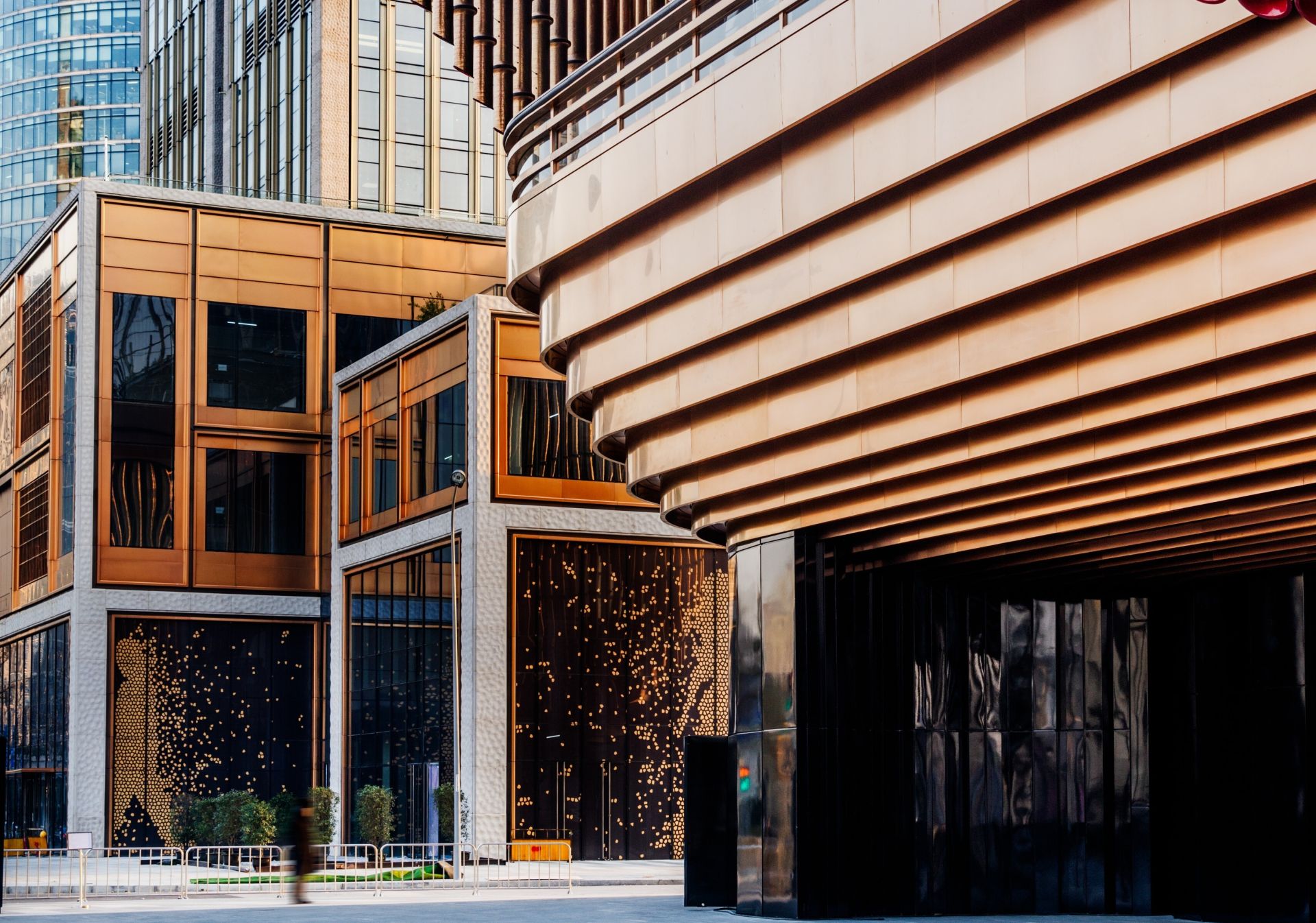Low angle black and white view of a modern skyscraper in San Francisco, highlighting glass reflections.